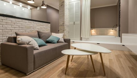 Where to end laminate flooring at doorways?